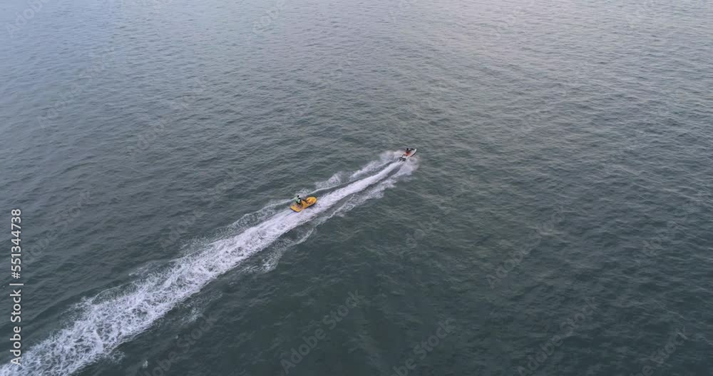 Jet ski aerial view. Water sports example, active leisure. Drone shot. Travel, vacation concept Jet ski aerial view. Water sports example, active leisure. Drone shot. Travel, vacation concept