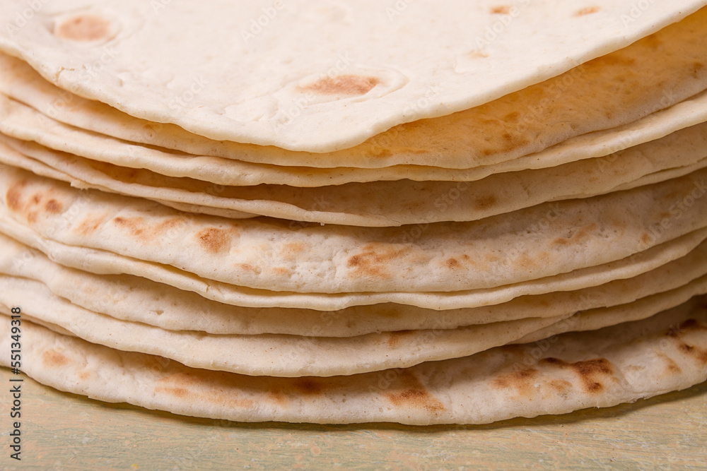 A stack of Mexican tortillas, on a gray table, top view, close-up, no people, A stack of Mexican tortillas, on a gray table, top view, close-up, no people,