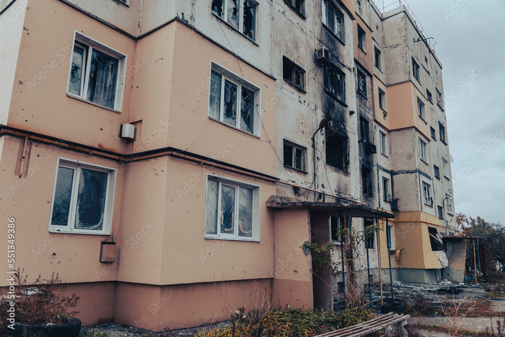 Fototapeta premium Entrance of a residential building destroyed by shelling. War in Ukraine
