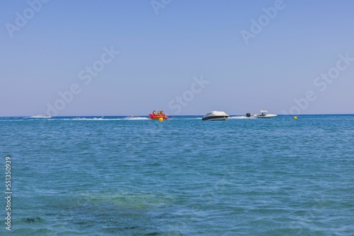 Beautiful view of sea activities for tourists. Blue sea water surface and blue sky background. Rhodes. Greece. 