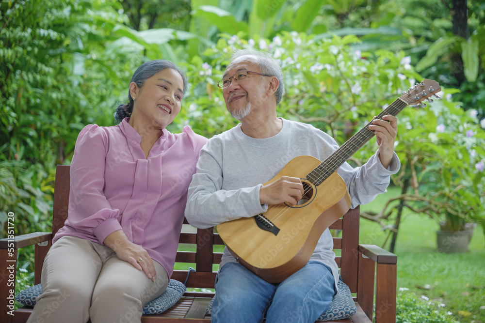 Happy Asian senior couple elderly man playing guitar while his wife singing together outdoors at home, Activity family health care, Enjoying lifestyle during retirement life having fun of senior older