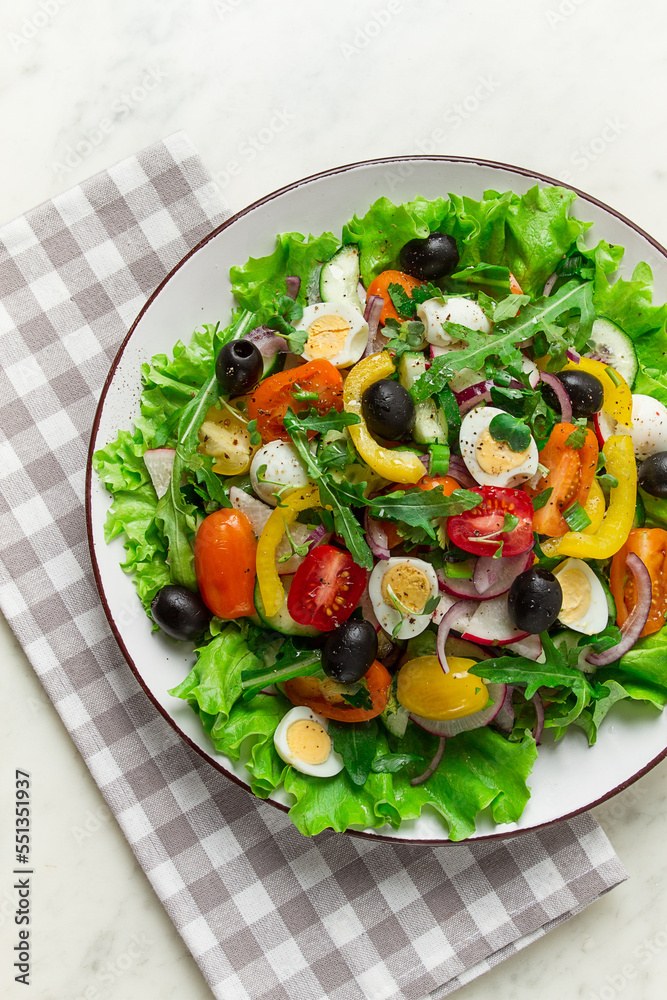 Vegetable salad , with quail eggs and olives, fresh, close-up, no people,