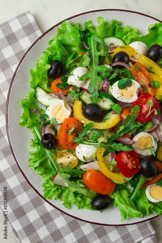 Vegetable salad , with quail eggs and olives, fresh, close-up, no people,