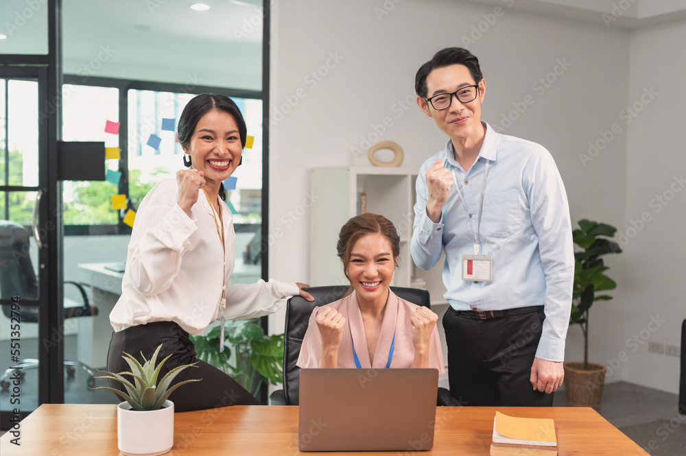 Asian businessteam smile and raise hands up celebration, feeling happy, complete finish job, teamwork successful achievement working in office concept. Asian businessteam smile and raise hands up celebration, feeling happy, complete finish job, teamwork successful achievement working in office concept.