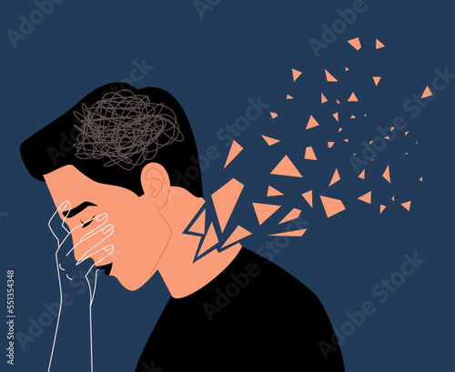 Upset adult man with confused thoughts holds the head with her hand. Concept of depression, anxiety, fatigue, borderline personality disorder