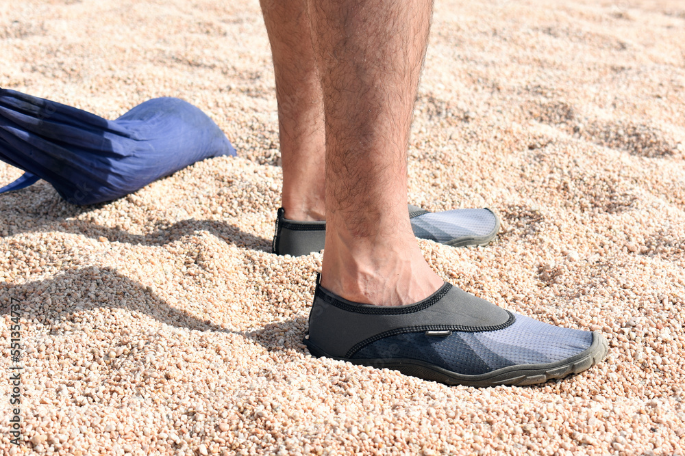 Fototapeta premium Man wearing water shoes