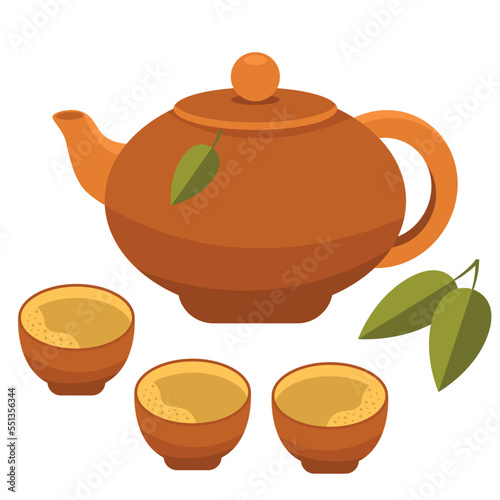 Traditional Chinese clay teapot and tea cups. Green tea leaves. Tea ceremony in China and Japan.