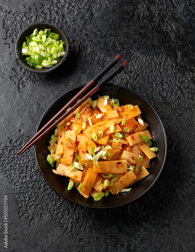 Tableau sur toile Spicy bamboo shoot salad in black bowl. Asian food