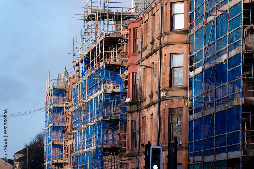 Scaffolding surrounding house development for safe access to construction work