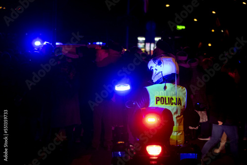 policja policeman on a motorbike at night