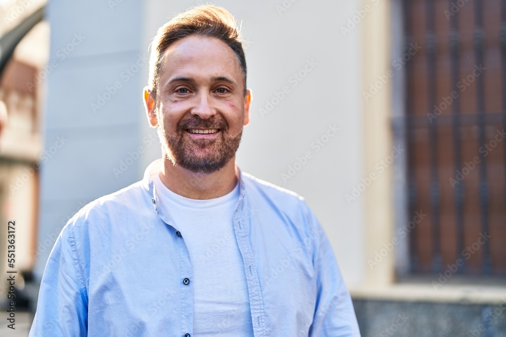 Young caucasian man smiling confident standing at street Young caucasian man smiling confident standing at street
