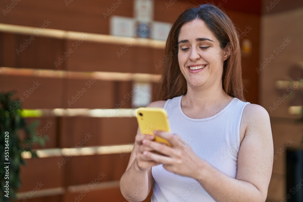Young woman smiling confident using smartphone at street Young woman smiling confident using smartphone at street