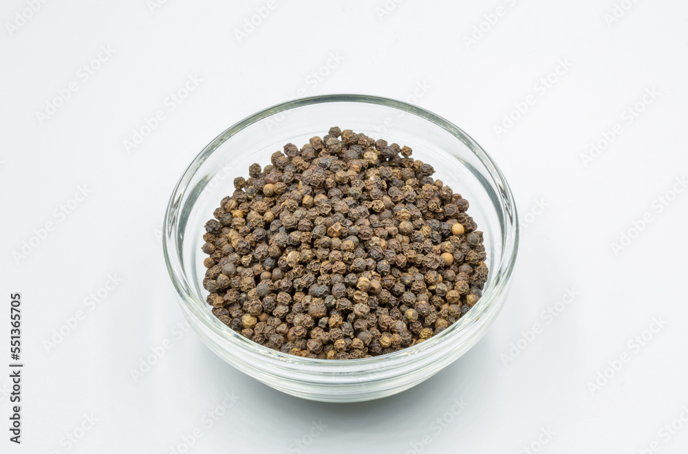 Black pepper closeup on white background Black pepper closeup on white background