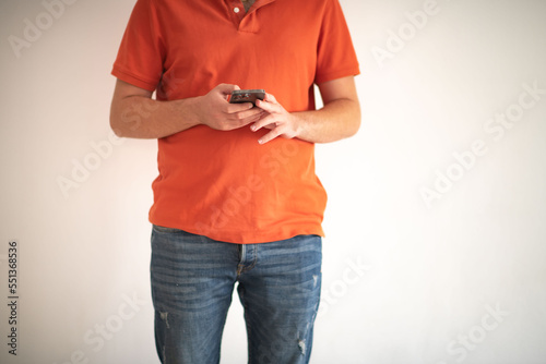 Man typing something in the smartphone