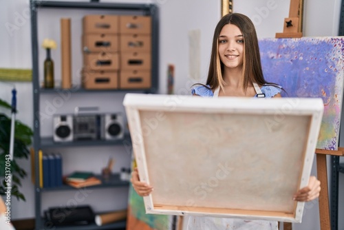 Adorable girl artist smiling confident looking draw at art studio