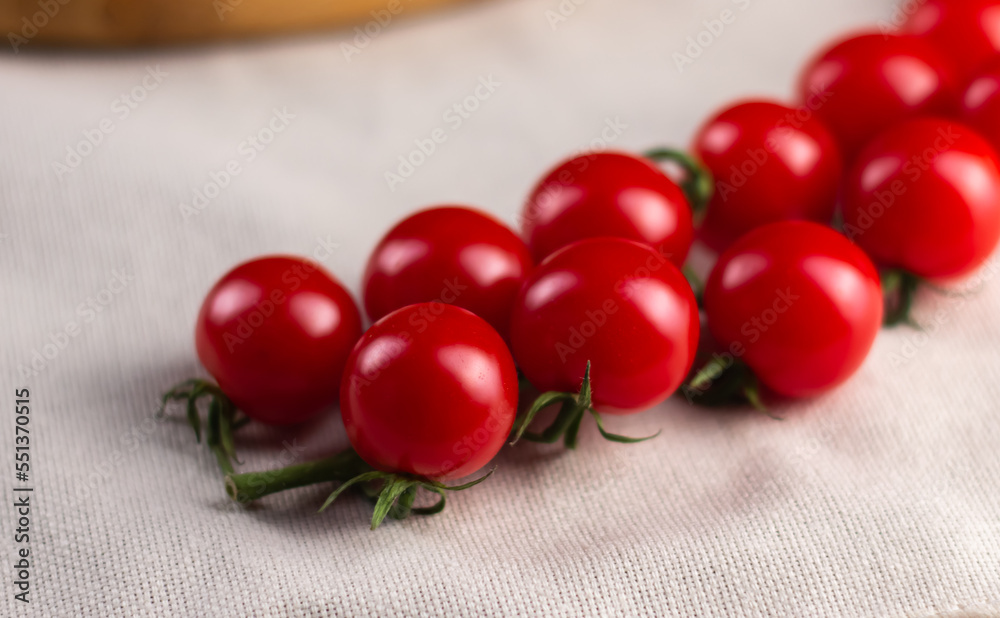 juicy cherry tomatoes on a branch juicy cherry tomatoes on a branch