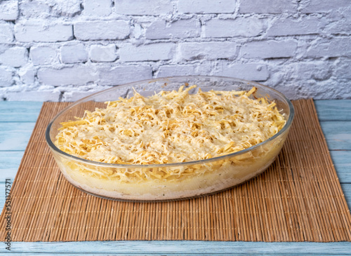 Brazilian recipe of chicken fricassee isolated over brick wall