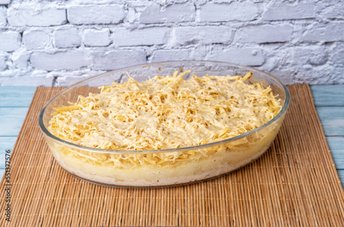 Brazilian recipe of chicken fricassee isolated over brick wall