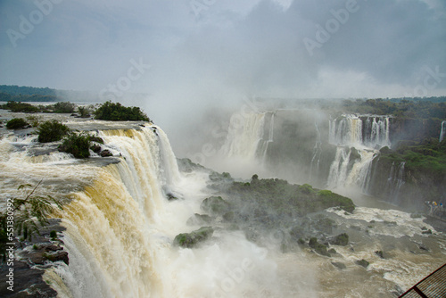 Iguazu Falls with tourists on a rainy day