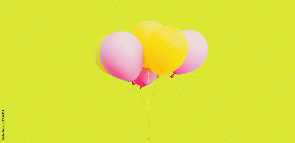 Bunch of festive colorful yellow pink balloons on background