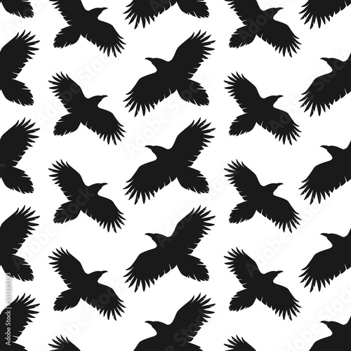 Silhouettes of flying ravens. Black and white seamless pattern. Best for textile, wallpapers, wrapping paper, package and decoration.