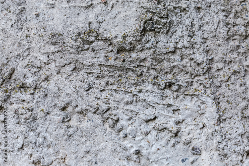 Fragment of the old concrete wall, outdoors in overcast weather