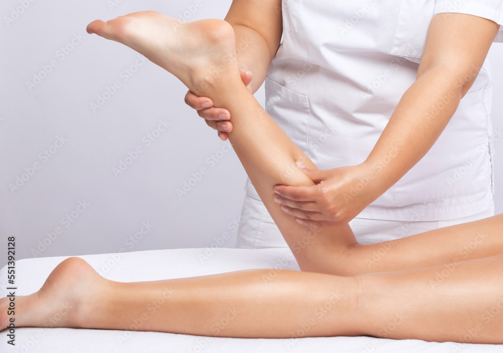 Masseur makes anti-cellulite massageon the legs in the spa. Overweight treatment, body sculpting.Cosmetology and massage concept. Masseur makes anti-cellulite massageon the legs in the spa. Overweight treatment, body sculpting.Cosmetology and massage concept.