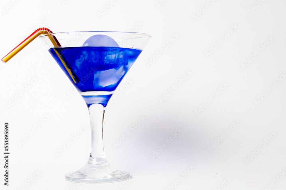 A blue coktail isolated in white background. A blue coktail isolated in white background.