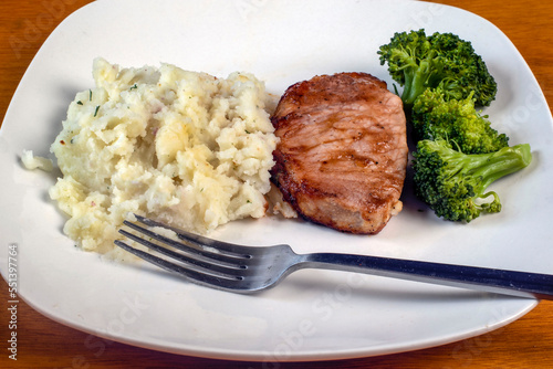 boneless barbecue pork chop with broccoliand red mashed potatoes