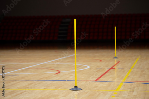 Training cones on hardwood court floor. Basketball, futsal, handball and volleyball practice. Game Equipment Horizontal sport theme poster, greeting cards, headers, website and app