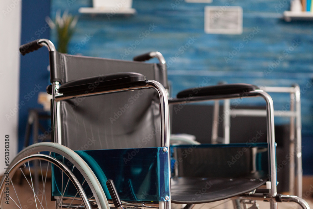 Wheelchair placed for person with disability in empty room of nursing