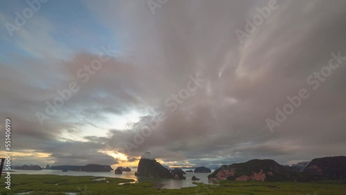 time lapse sunrise at Samet Nangshe, mountain valley hills, .and tropical green forest trees at sunrise with archipelago in Andaman sea in Phang Nga Bay. . Natural archipelago landscape background. photo