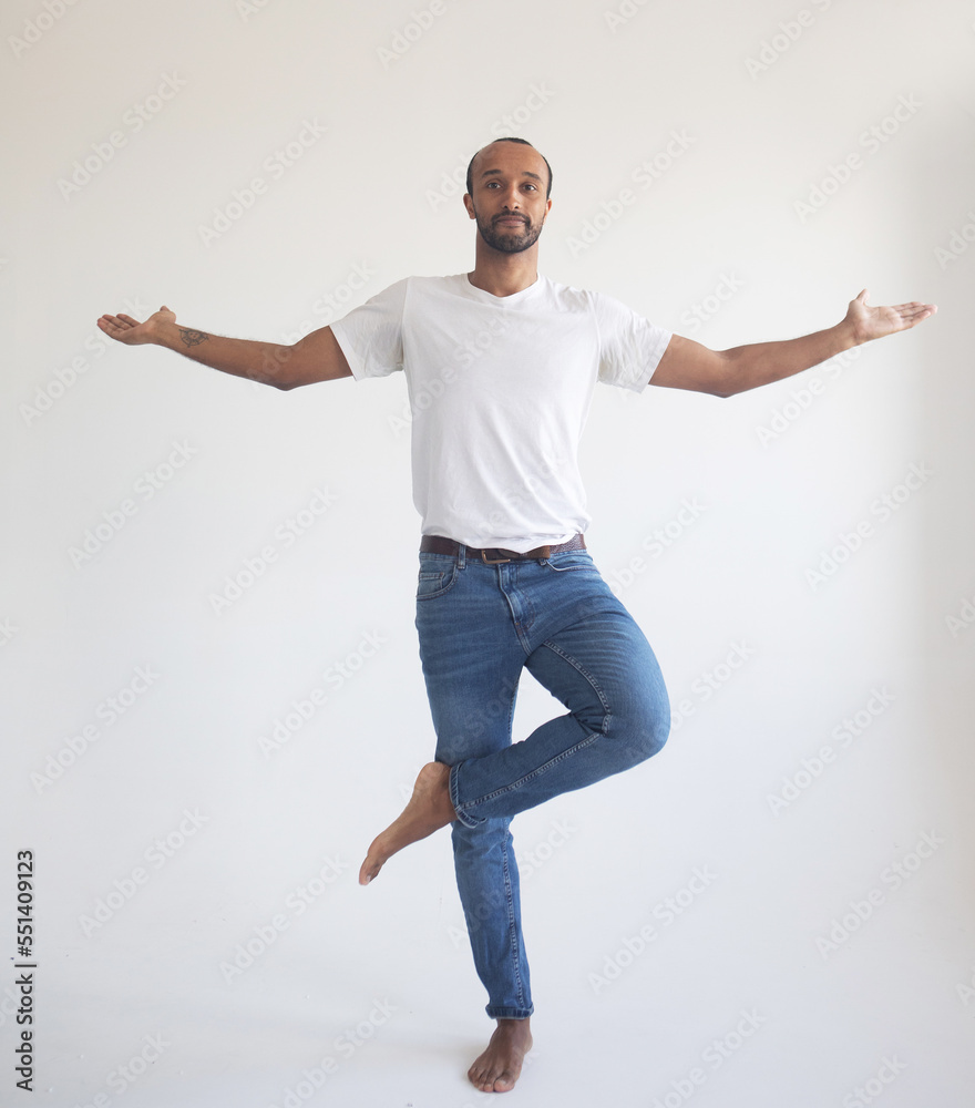 young black man wears white shirt hold spreading hands in yoga aum gesture relax meditate try to calm down young black man wears white shirt hold spreading hands in yoga aum gesture relax meditate try to calm down
