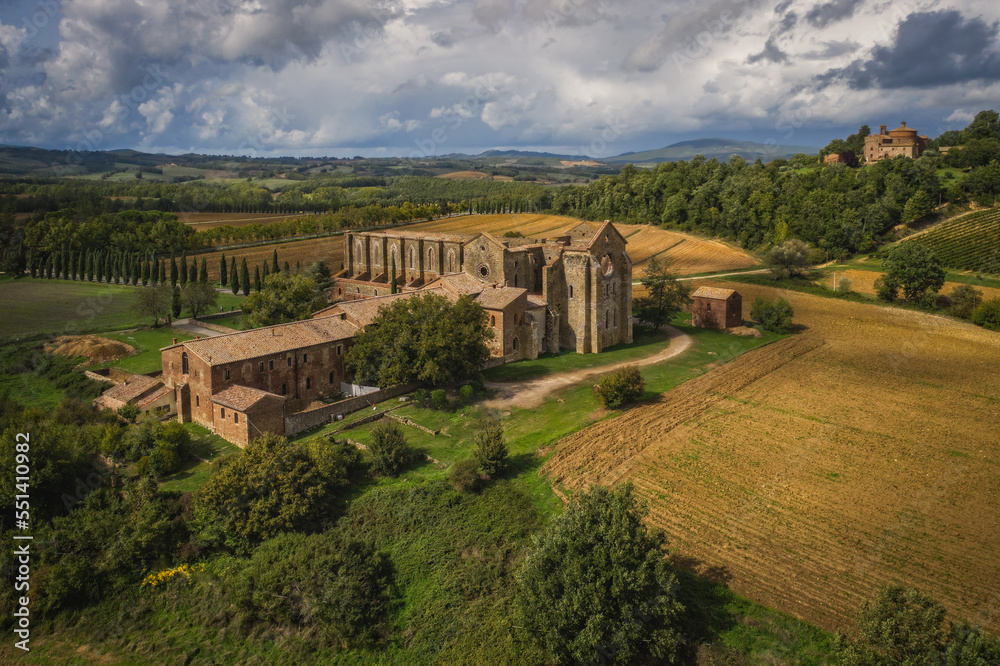 Aerial view of the abbey of San Galgano: is located about 25 miles from Siena, in southern Tuscany, Italy, Siena region - September, 2022 - obrazy, fototapety, plakaty 