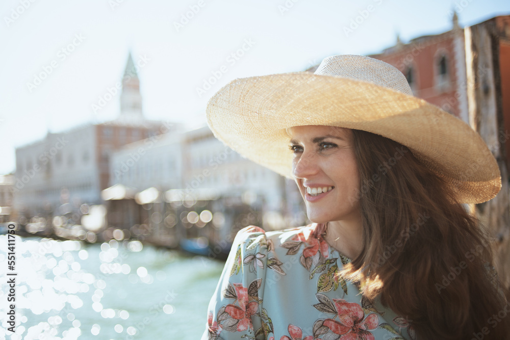 happy modern solo tourist woman in floral dress sightseeing