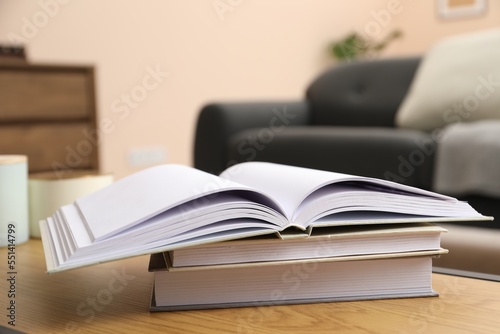 Books on wooden table in living room