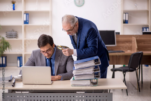 Two male colleagues working in the office