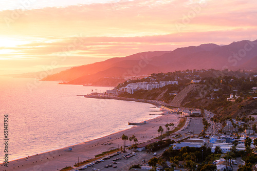 Fototapeta Naklejka Na Ścianę i Meble -  Coastline landscape over Malibu, California during a colorful sunset showing the beach and ocean that you can travel to from pacific palisades