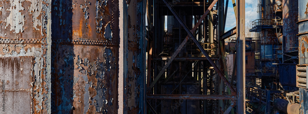 Panoramic image of the massive dimension of the abandoned turn-of-the-century Bethlehem steel plant as the rust flakes off the tanks