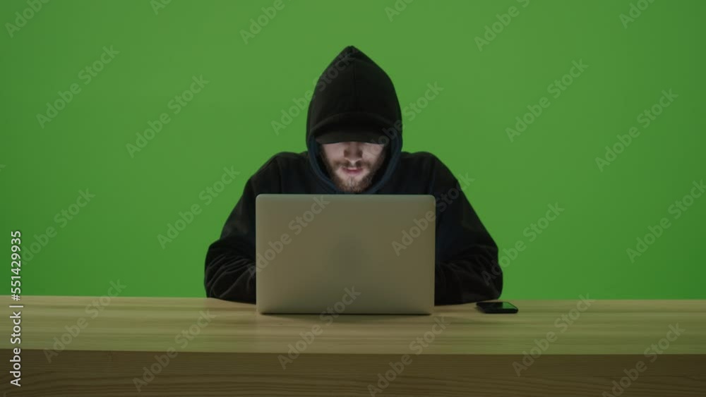 Unrecognizable Man Hacker Wearing Sweatshirt with Hood and Cap Typing ...