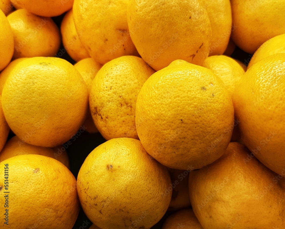 pile of fresh Lemons. Yellow lemons are sold in traditional markets. pile of fresh Lemons. Yellow lemons are sold in traditional markets.