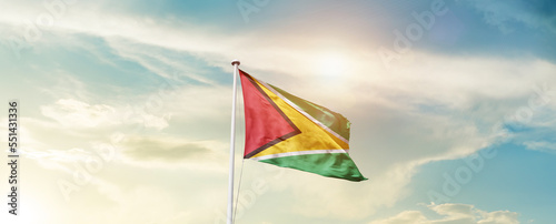 Waving Flag of Guyana with beautiful Sky.