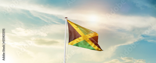 Waving Flag of Jamaica with beautiful Sky.