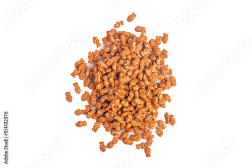 Stack of granulated cat food on white background