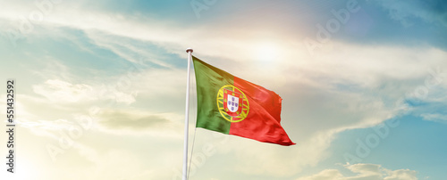 Waving Flag of Portugal with beautiful Sky.