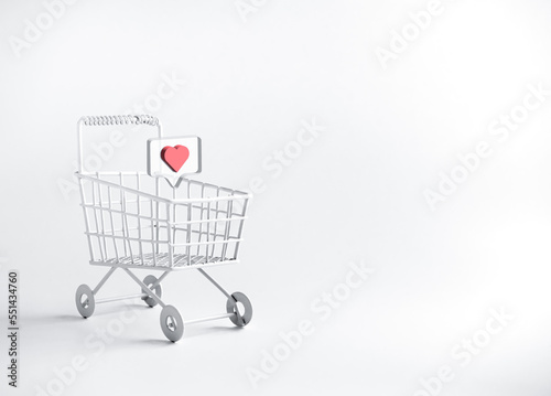 3d heart, love or like social media icon in shopping trolley cart supermarket isolated on white background, minimal style. Shopping lover, online business management and marketing interest concepts.