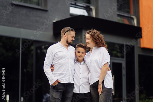 Family walking in the city. Smiling and having fun © andriyyavor