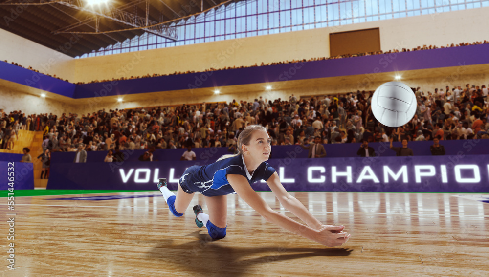 Obraz premium Female volleyball players in action on professional stadium. 