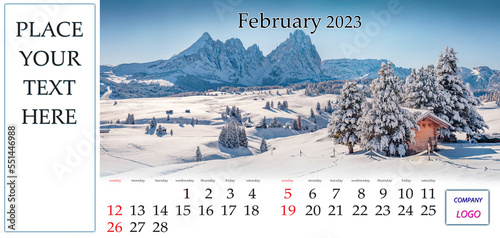 February 2023. Desktop monthly calendar template with place logo and contact information. Set of calendars with amazing landscapes. Snowy winter view of Alpe di Siusi ski resort, Dolomite Alps, Ityaly photo