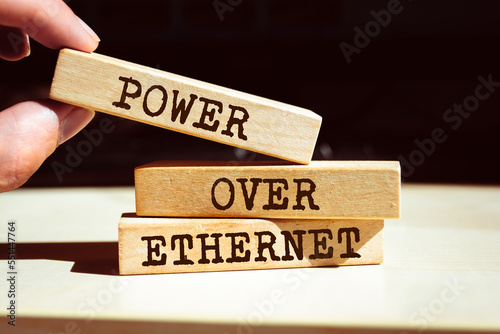 Wooden blocks with words 'Power Over Ethernet'. PoE